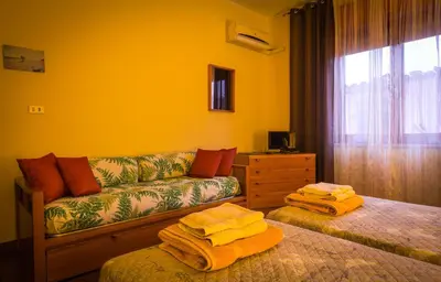 Letto o letti in una camera di Su Connotu