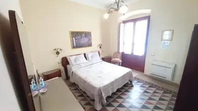 Letto o letti in una camera di B&B Antica Villa