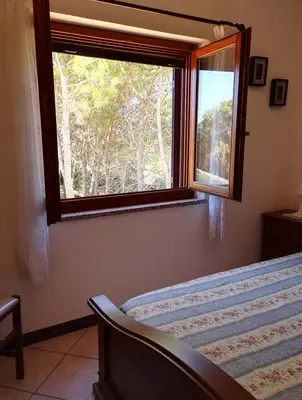 Letto o letti in una camera di Pineta Spiaggia Grande