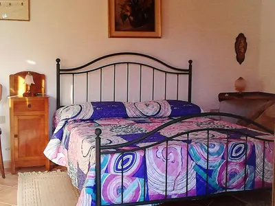 Letto o letti in una camera di B&B I Menhir