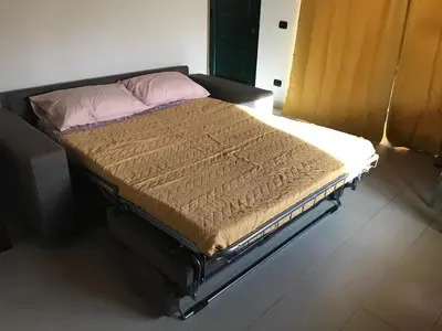 Letto o letti in una camera di Terrazza sul golfo degli angeli