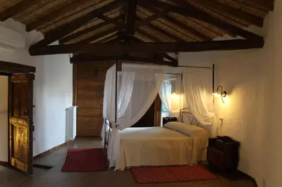 Letto o letti in una camera di B&B Charme Sa Pardina