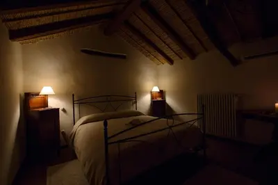 Letto o letti in una camera di B&B Charme Sa Pardina