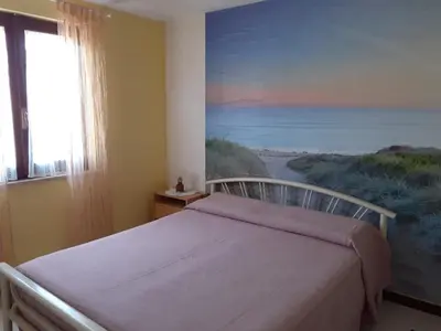 Letto o letti in una camera di Casa Vacanze Bouganville