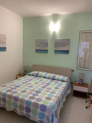 Letto o letti in una camera di Appartamento nel cuore di Villasimius
