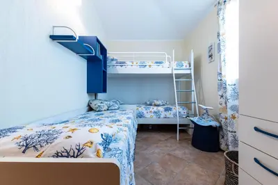 Letto o letti in una camera di La Casa delle Conchiglie