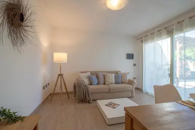 Area soggiorno di Capitana Rooms