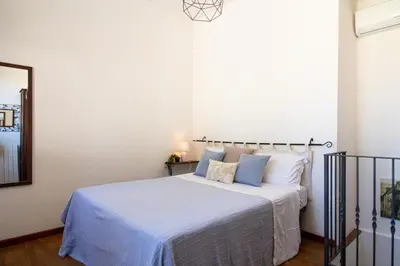 Letto o letti in una camera di Capitana Rooms
