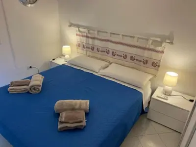 Letto o letti in una camera di Mare Smeraldo Appartamento