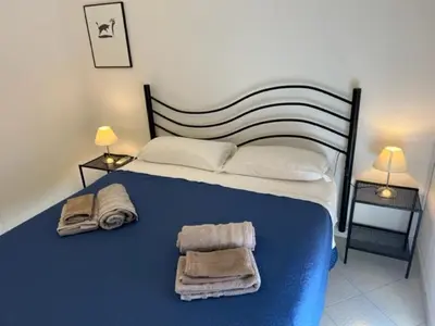Letto o letti in una camera di Mare Smeraldo Appartamento
