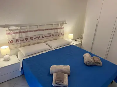 Letto o letti in una camera di Mare Smeraldo Appartamento