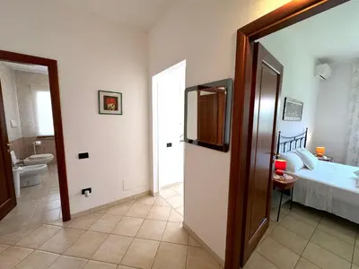 Letto o letti in una camera di Rosa's House - zona ospedaliera