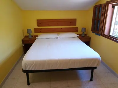 Letto o letti in una camera di Chia Zeffiro
