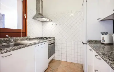 Cucina o angolo cottura di 3 Bedroom Nice Home In Costa Rei -Ca-
