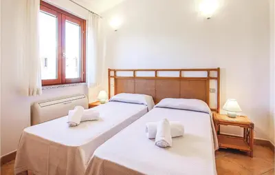 Letto o letti in una camera di 3 Bedroom Nice Home In Costa Rei -Ca-