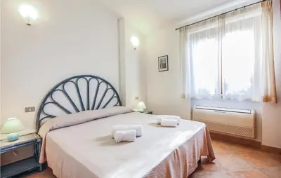 Letto o letti in una camera di 3 Bedroom Nice Home In Costa Rei -Ca-