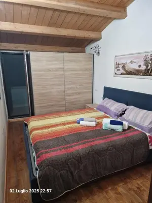 Letto o letti in una camera di Casa Zia Mariolina