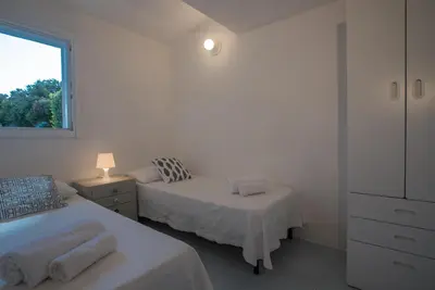 Letto o letti in una camera di Sul Mare Sardegna Villa Eudora