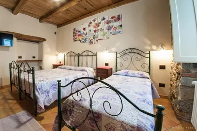 Letto o letti in una camera di Cuccumiao