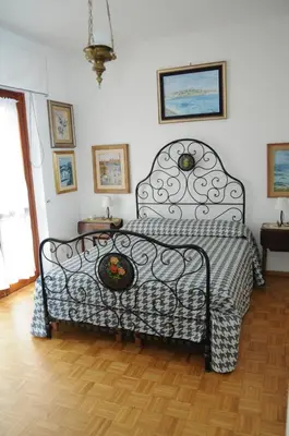 Letto o letti in una camera di Ilm Cagliari
