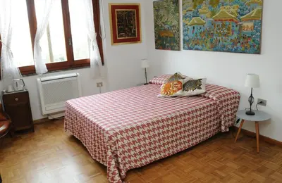 Letto o letti in una camera di Ilm Cagliari