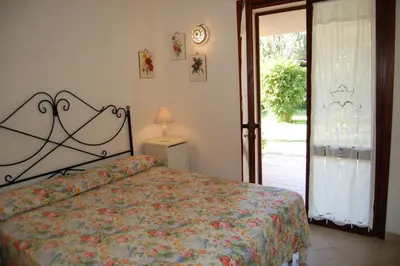 Letto o letti in una camera di Casa Le Tuie