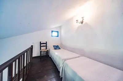 Letto o letti in una camera di Casa Le Tuie