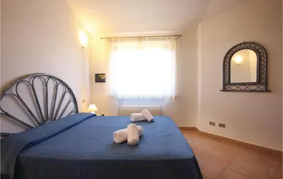 Letto o letti in una camera di Cozy Home In Costa Rei -Ca- With Wifi