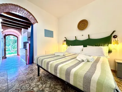 Letto o letti in una camera di Le Corti Sarde Countryside