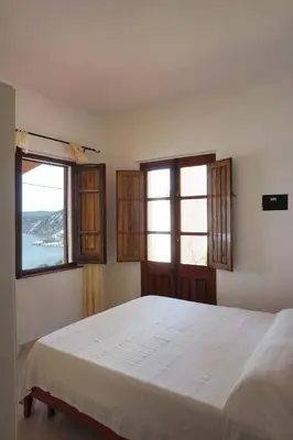Letto o letti in una camera di Gutturu de Flumini
