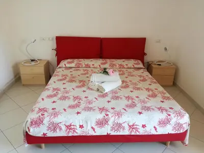 Letto o letti in una camera di Casa Letizia
