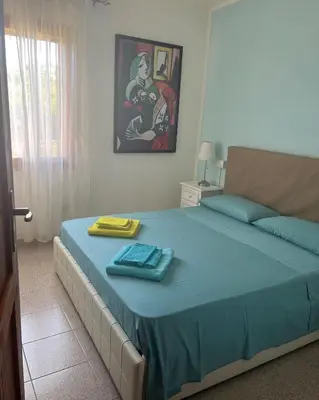 Letto o letti in una camera di Villetta Indipendente Sardegna