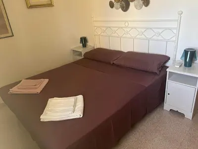 Letto o letti in una camera di Villetta Indipendente Sardegna