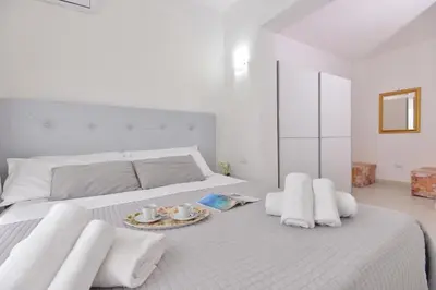 Letto o letti in una camera di IzzHome New One