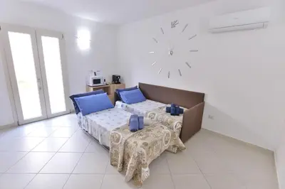 Letto o letti in una camera di IzzHome New One