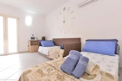 Letto o letti in una camera di IzzHome New One