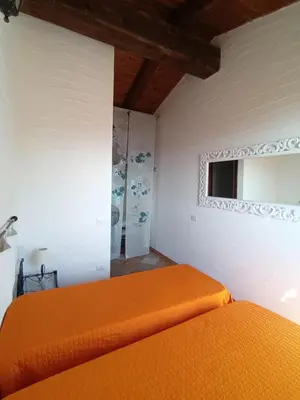 Letto o letti in una camera di La Villa Tanca Piras