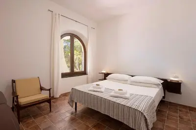 Letto o letti in una camera di Villa Eliana sul Mare