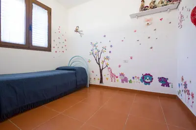 Letto o letti in una camera di Appartamenti Torre di Barì