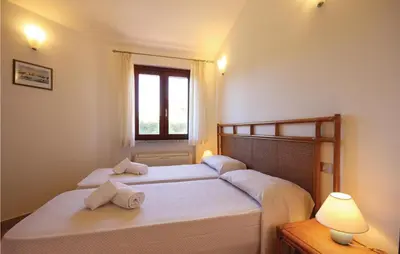 Letto o letti in una camera di Cozy Home In Costa Rei -Ca- With Wifi