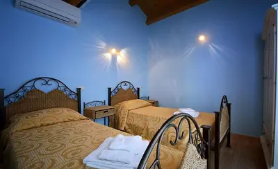Letto o letti in una camera di B&B Il Cenerino