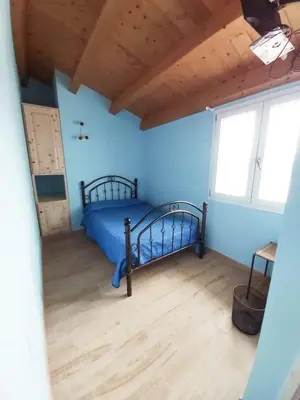 Letto o letti in una camera di B&B Il Cenerino