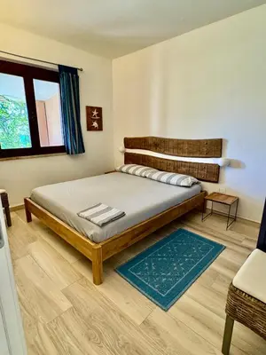 Letto o letti in una camera di Prima fila Costa Rei