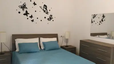Letto o letti in una camera di Casa Rubina