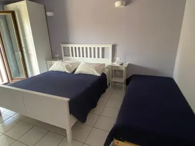 Letto o letti in una camera di Casa Daniela