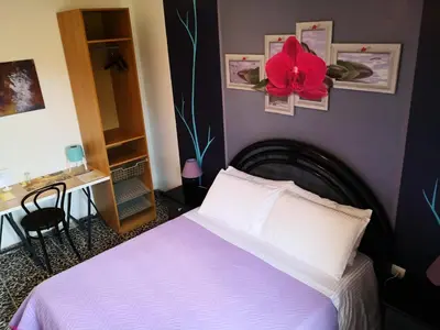 Letto o letti in una camera di Zia Chiarina