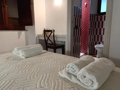 Letto o letti in una camera di Zia Chiarina