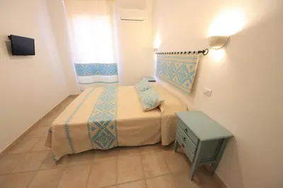 Letto o letti in una camera di ### Appartamenti sulla SPIAGGIA al POETTO ###