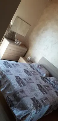 Letto o letti in una camera di B&B GLI ULIVI
