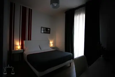 Letto o letti in una camera di La Libra Rooms